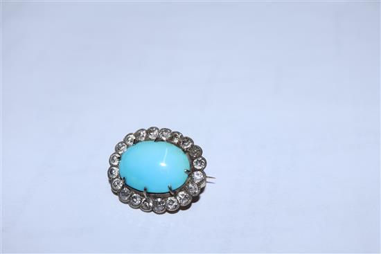 A Victorian yellow metal brooch, with oval turquoise cabochon surrounded by old-cut diamonds, 23mm.